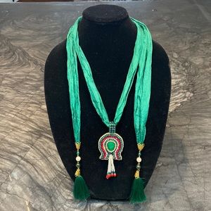 Uniqu neckpiece, scarf- like and a great substitute for a colorful necklace.